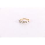 18ct gold and platinum diamond five stone dress ring, the central diamond approximately 0.3ct,