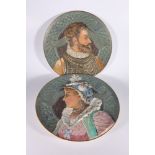 Pair of Austro-German pottery chargers of Cardinal Alessandro & Maria Farnese, 42.5cm diameter