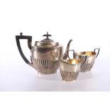 George V silver three piece tea set of half gardooned design by Walker and Hall, Sheffield 1913