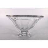 Large heavy glass centrepiece bowl with flaring scalloped trumpet bowl raised on square base,