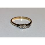 18ct gold and platinum diamond three stone ring, makers mark F.J, 2.1g