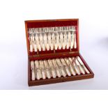Set of twelve mother of pearl handled fish knives and forks with engraved silver plated blades and