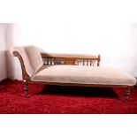 Victorian carved oak chaise longue raised on turned supports and brass castors, 175cm long, 75cm