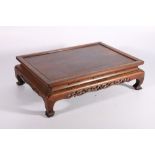 Large 19th century Chinese hardwood stand, the rectangular top with shaped and pierced carved apron,