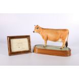 Royal Worcester porcelain model of a Jersey Cow modelled by Doris Lindner on wooden plinth base with