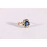 18ct gold sapphire blue stone and diamond ring, the blue stone approximately 10mm x 8mm encircled by