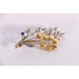 Unhallmarked yellow and white metal diamond and saphirre floral spray brooch, the two largest of the