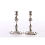 A near pair of silver tapersticks or taper candlesticks, one by James Parkes London 1898, the