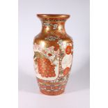A large Japanese Kutani high shouldered vase, decorated with two panels depicting a rider and