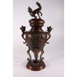 Japanese incense burner on triple supports, the domed lid with kylin finial, the bulbous body