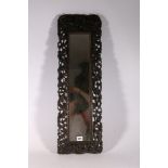 Chinese late 19th century carved and pierced mirror frame, the frame depicting dragons amongst