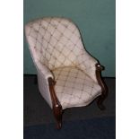 Victorian mahogany cream upholstered armchair raised on cabriole supports.