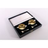 Pair of silver table salts of quaich form having gilded interior bowls with salt spoons by