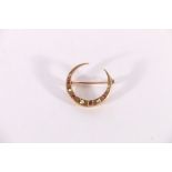 9ct yellow gold crescent moon brooch set with rubies and seed pearls, 2.5cm diameter, 3.1g gross