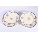 Two French Sevres porcelain Feuille-De-Choux plates, hand painted with rose floral bouquets by