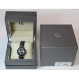 G. C. Guess Collection two-eye day/date lady's wristwatch with black dial, bezel and ceramic