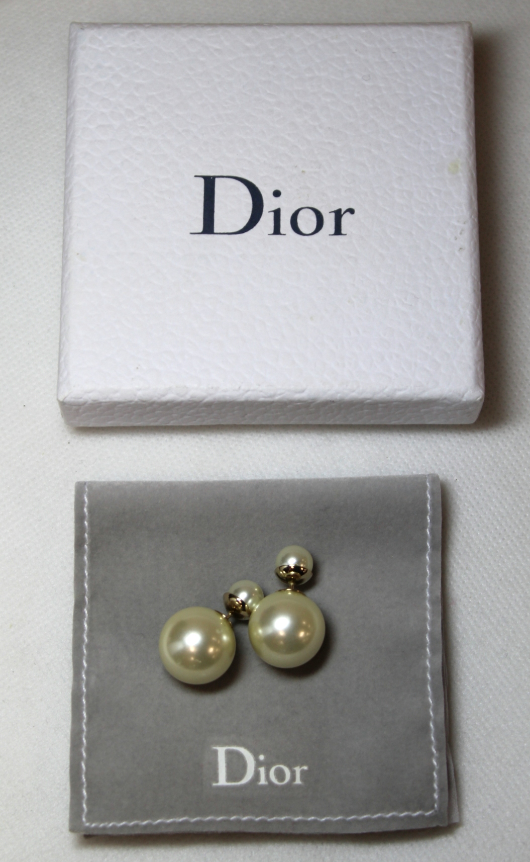 Pair of Dior 'Tribales' simulated pearl earrings. Boxed with jewellery pouch.