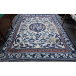 Large Chinese blue and white wool carpet with central dragon medallion and dragon spandrels