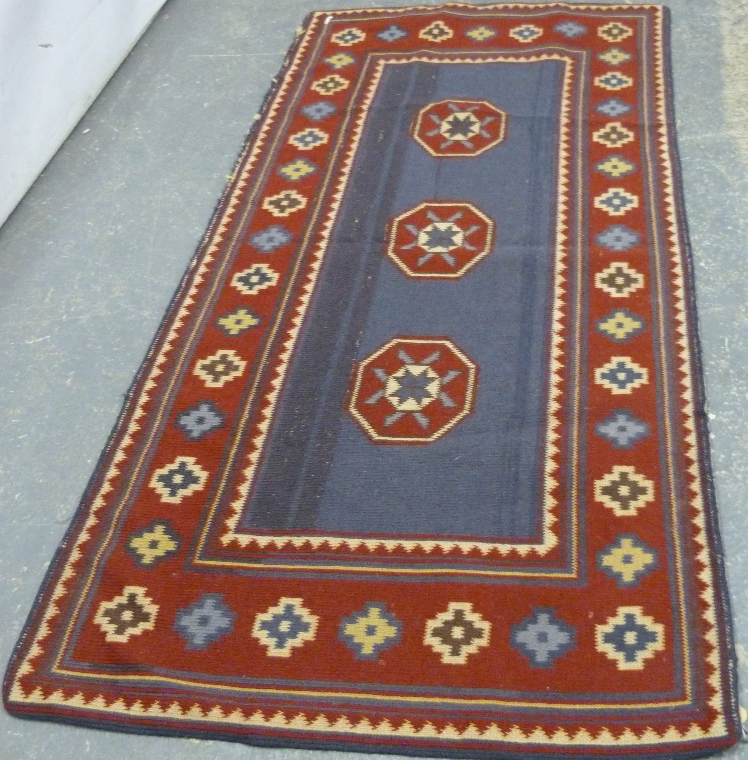 Small Eastern modern flat weave rug, 144cm x 75cm.