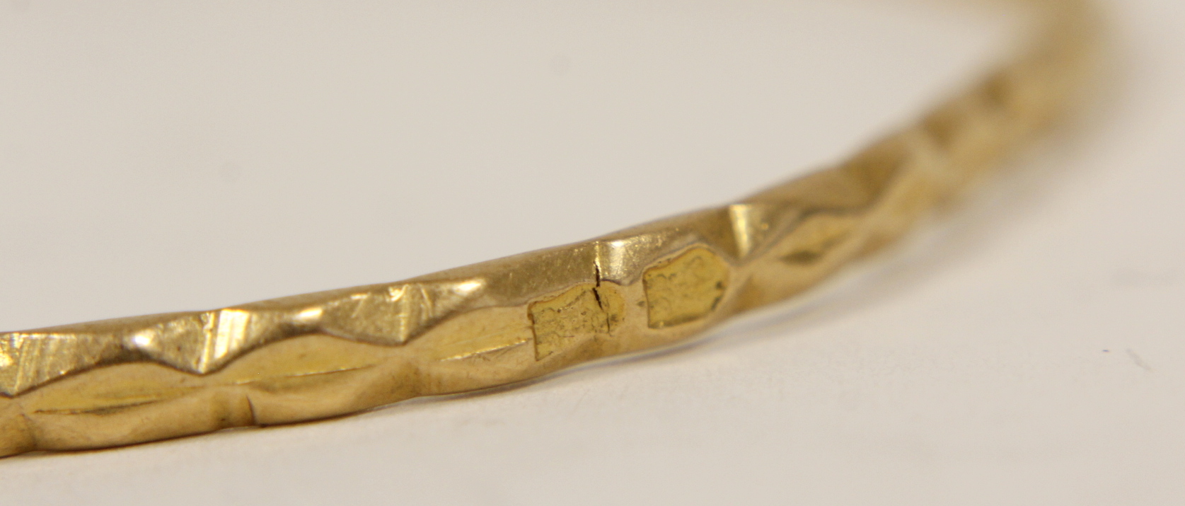 Gold slave bangle, probably Oriental 'fine' indistinctly marked, 13g. - Image 3 of 3