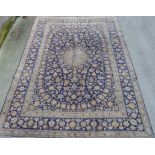 Large Eastern wool on cotton blue and gold floral carpet, 420cm x 296cm.