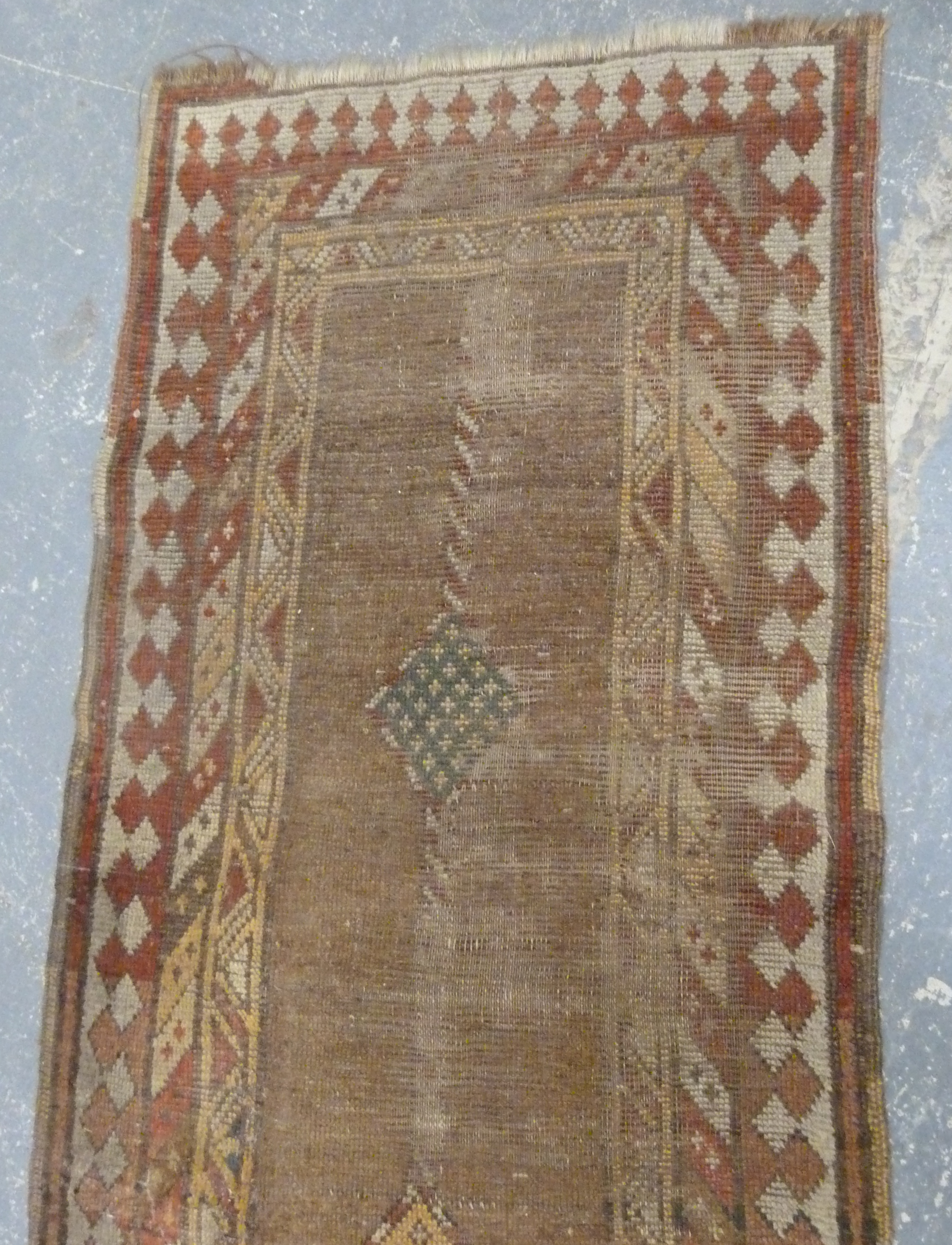 Turkish wool runner with geometric medallions and borders in muted palette, 285cm x 83cm, well worn. - Image 4 of 4