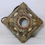 Victorian or Edwardian sea shell mounted frame or pocket watch holder of diamond form, 24cm wide.