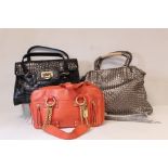Three DKNY lady's handbags: coral leather with gilt hardware; pewter woven leather with detachable