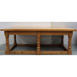 Pine refectory style farmhouse kitchen table on turned and block supports.