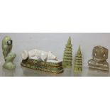 Carved white hardstone figure of a recumbent dog, 8.5cm long, with fabric covered fitted stand; a