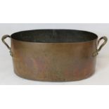 Large 19th century twin handled copper pan of oval form fitted with metal liner for use as a