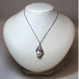 Balenciaga Mother of Pearl and white crystal necklace in the form of a flower bud. Boxed with