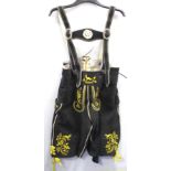 Pair of modern Bavarian men's lederhosen in black suede with yellow embroidery of ibex and