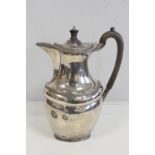 Silver hot water pot of oval baluster shape, by Harry Atkin, Sheffield 1902. 20oz.