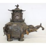 Chinese Qing dynasty large bronze censer in the form of an elephant with pierced pagoda howdah top