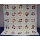 20th century applique block quilted bedspread with multiple polychrome fan roundels in cream squares