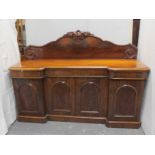 Victorian mahogany inverted breakfront sideboard the carved back over four arched panelled door