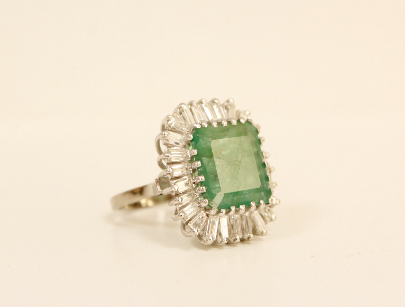 Impressive diamond and emerald cluster ring, the emerald given as approx. 3.5ct surrounded by