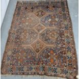 Persian wool rug with central triple diamond lozenge, some wear, 175cm x 130cm.