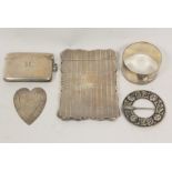 Silver card case by A Thomason, Birmingham 1861, a vesta case, a paper clip, a brooch and a napkin