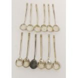 Set of twelve Russian parcel gilt silver tea spoons, engraved, with spiral stems. c1895, 198g.