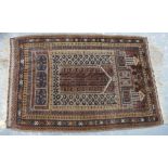 Persian wool prayer rug with central mihrab in browns, blues and creams,, 141cm x 91cn.