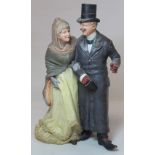 Late 19th/early 20th century Continental (Eichwald?) pottery figure group of a smartly dressed