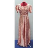 Vintage 1930's pink satin evening dress with puff sleeves, ruched bodice, belt and flared bias cut