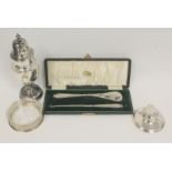 Silver baluster caster, 1903, a butter dish with liner, an inkwell and other items, mostly silver.