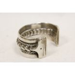 Middle Eastern heavy silver bangle with corded centre, 148g gross.