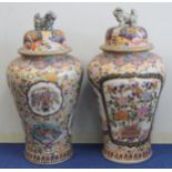 Near matching pair of very large Oriental covered floor vases of baluster form, one with large