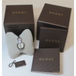 Gucci lady's stainless steel wristwatch with Mother of Pearl dial and diamond embellishment (total