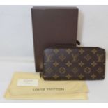 Louis Vuitton monogrammed coated fabric zipped purse with cow hide leather lining, stamped Louis