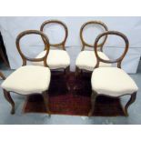 Set of four Victorian balloon back dining chairs with upholstered seats on cabriole supports